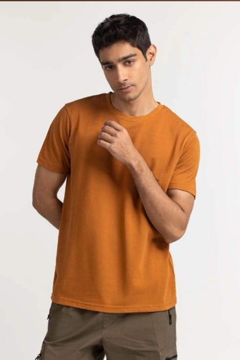 Man wearing an orange t-shirt on a white background